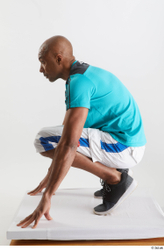 Whole Body Man Black Sports Shirt Shorts Slim Kneeling Studio photo references